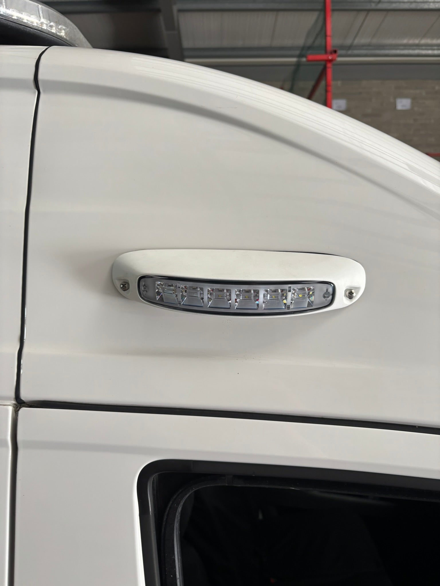 SL209 LED scene light surface mount 12V 24V
compact LED utility light for vehicle exterior
side view of SL209 SceneLite LED flood light
mounted SL209 LED scene light on emergency vehicle