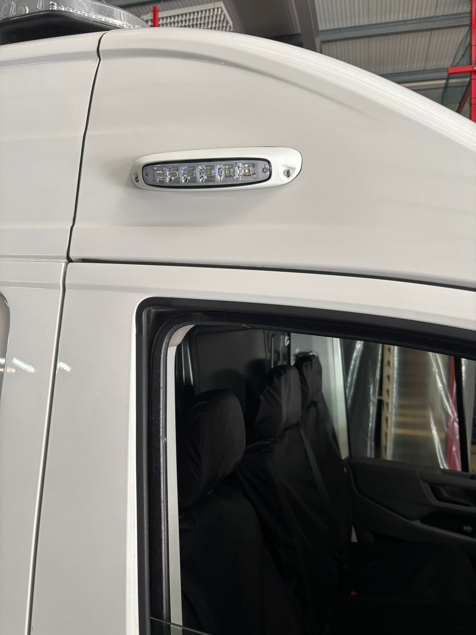 SL209 LED scene light surface mount 12V 24V
compact LED utility light for vehicle exterior
side view of SL209 SceneLite LED flood light
mounted SL209 LED scene light on emergency vehicle